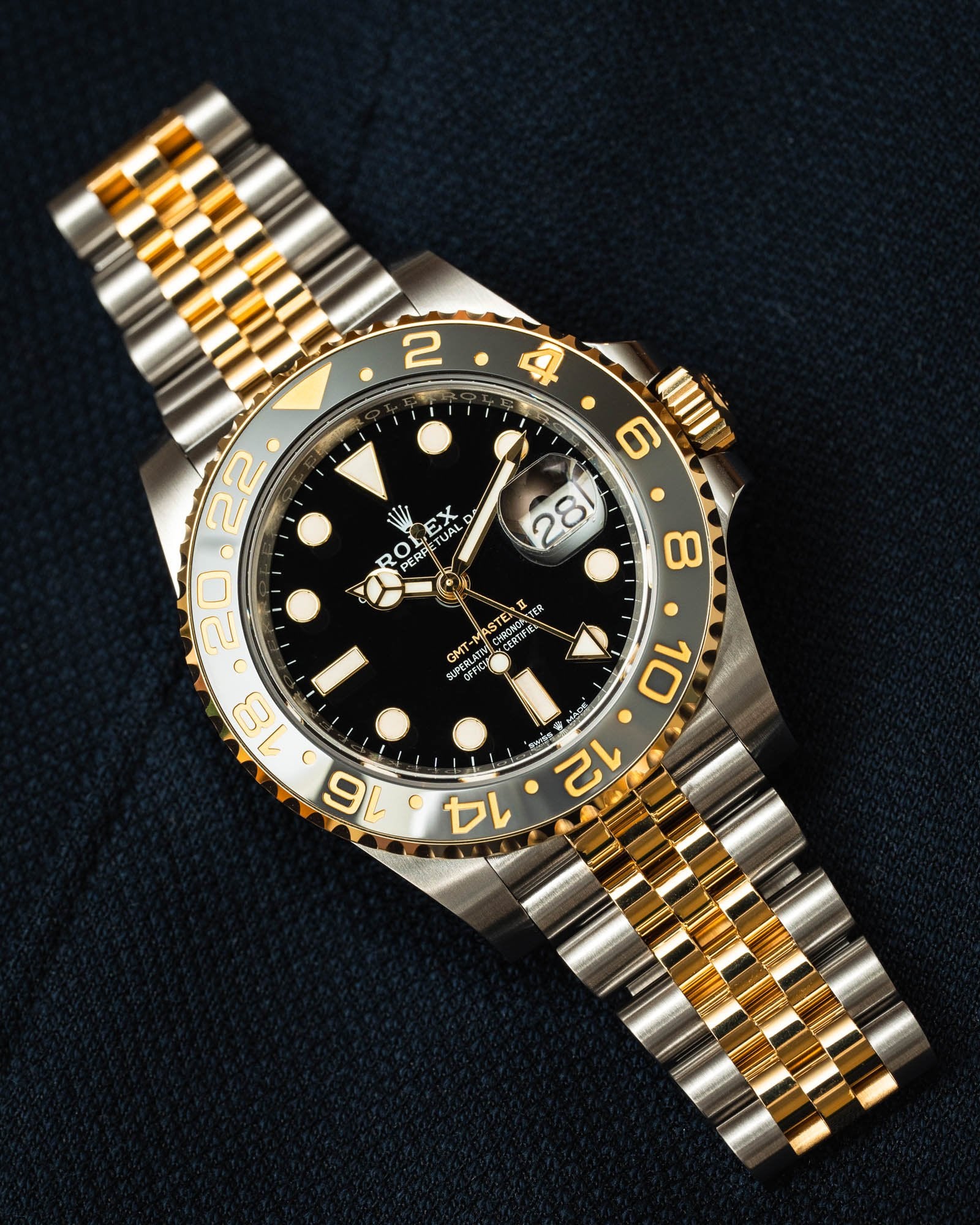 GMT-Master II yellow gold with a black dial and a Jubilee bracelet.