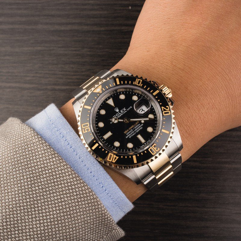Rolex Sea-Dweller yellow gold Bezel and black dial