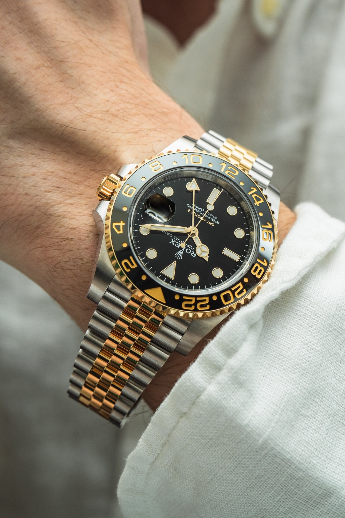 GMT-Master II yellow gold with a black dial and a Jubilee bracelet.